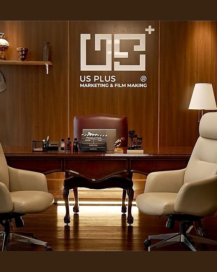 US Plus branded office desk with production clapperboard