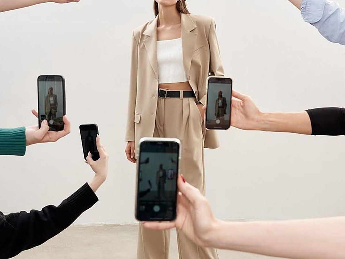 Influencer being filmed by multiple creators